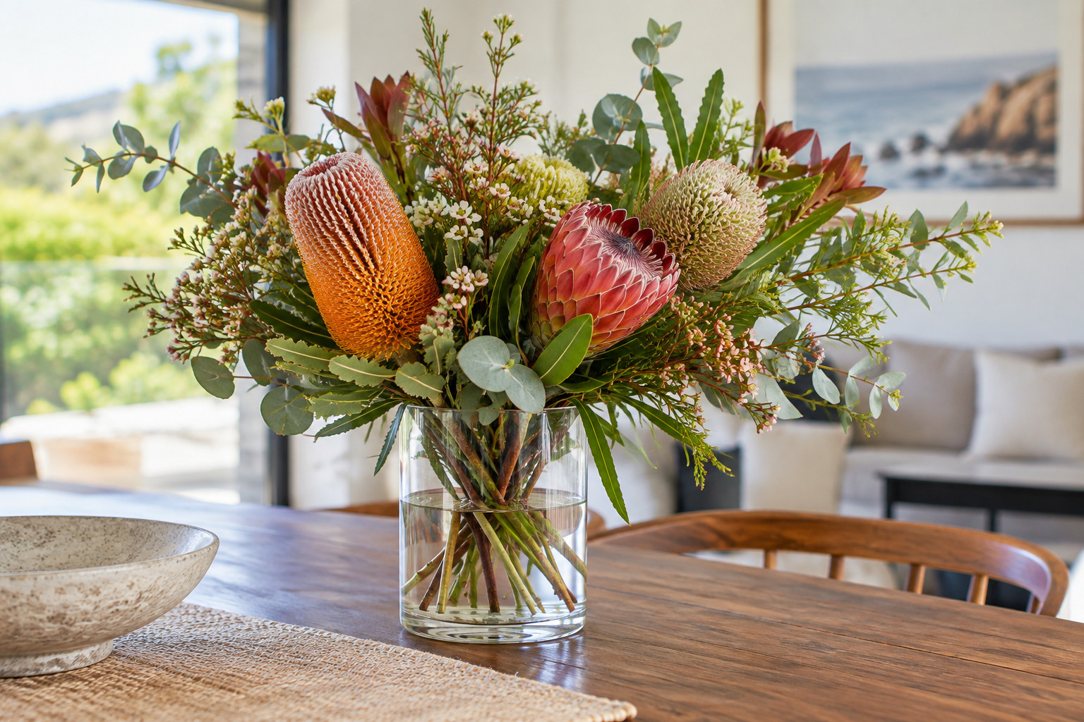 Fresh Australian native flowers in a glass vase on a home table